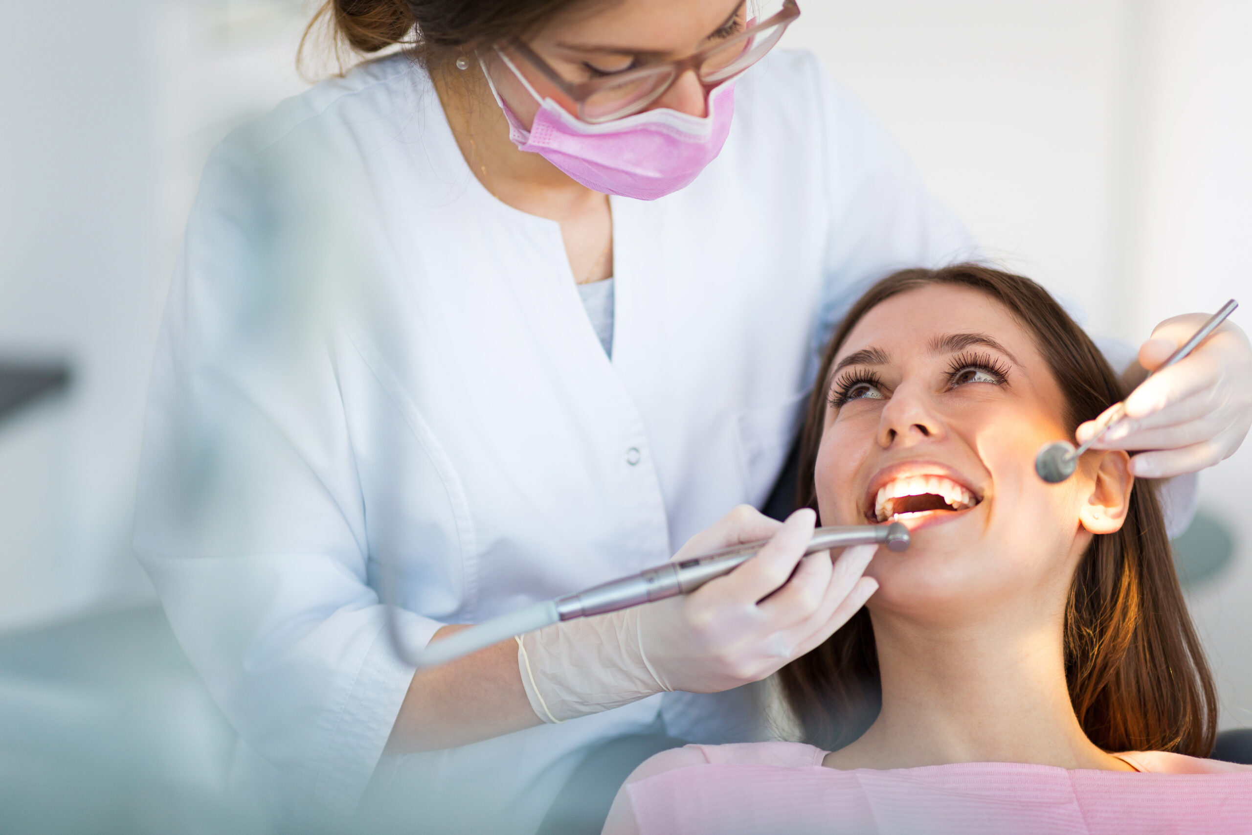 Dental hygienist during a teeth cleaning